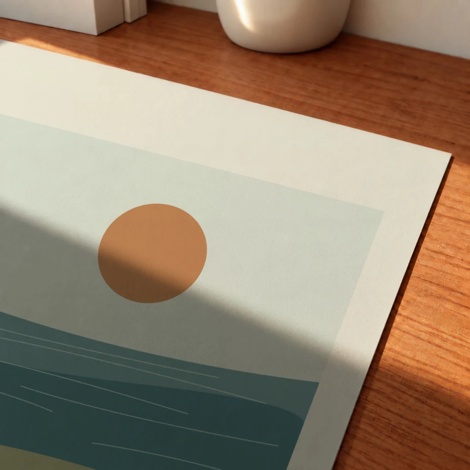 Sunlit Sheet Corner: Present your artwork as a large unframed print shown close up on a warm wooden desk.